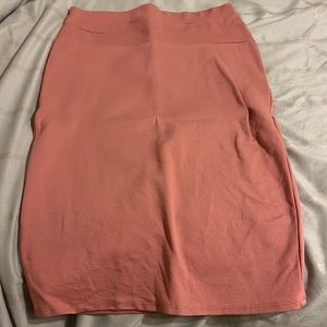 Selling a pink skirt from rainbow in a size L. No damage or stains at all
